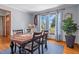 Elegant dining room featuring a large window and a classic table and chairs set at 1140 Buttercup Ln, Wake Forest, NC 27587