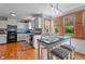 Charming kitchen with stainless appliances, and a breakfast nook with windows overlooking the yard at 1140 Buttercup Ln, Wake Forest, NC 27587