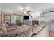 Comfortable living room with a fireplace, hardwood floors, and large windows at 1140 Buttercup Ln, Wake Forest, NC 27587