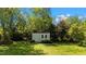 A well-maintained shed with green trim sits in the backyard, providing extra storage or workshop space at 1140 Buttercup Ln, Wake Forest, NC 27587