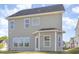 Back exterior view of a two story home showing gray vinyl siding, roofline, and windows at 12 Douglas Fir Pl, Clayton, NC 27520