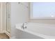 Bright bathroom features a soaking tub and a separate shower at 12 Douglas Fir Pl, Clayton, NC 27520