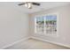 Bedroom features a ceiling fan with lights, neutral walls, and carpeted floor at 12 Douglas Fir Pl, Clayton, NC 27520