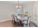 Elegant dining room with a chandelier and modern table set at 12 Douglas Fir Pl, Clayton, NC 27520