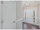 Bright foyer with hardwood floors, a white door and trim, and natural light at 12 Douglas Fir Pl, Clayton, NC 27520