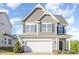 Charming two-story home with a two-car garage and attractive architectural details at 12 Douglas Fir Pl, Clayton, NC 27520