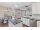 Bright kitchen with island overlooking living room, stainless appliances and granite countertops at 12 Douglas Fir Pl, Clayton, NC 27520