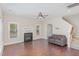 Spacious living room featuring hardwood floors, a fireplace, and staircase at 12 Douglas Fir Pl, Clayton, NC 27520