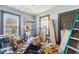 Cluttered room filled with boxes, ladder, shelving, and other items at 1207 Wall St, Durham, NC 27701