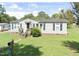 Charming single-story home with a well-maintained lawn and inviting front entrance at 125 S State St, Haw River, NC 27258