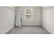 This walk-in closet features wire shelving and natural light at 126 Elmsford St, Durham, NC 27703