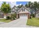 Attractive two-story home featuring a manicured lawn and an attached two-car garage at 126 Elmsford St, Durham, NC 27703