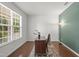 Bright home office with a large window, hardwood floors, and a stylish accent wall at 126 Elmsford St, Durham, NC 27703
