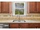 Close up view of a kitchen sink and counter with a view to the outside at 126 Elmsford St, Durham, NC 27703