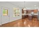 Open kitchen with stainless appliances, granite counters, and dark wood cabinets at 126 Elmsford St, Durham, NC 27703