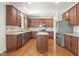 Spacious kitchen with granite countertops, island, stainless steel appliances, and wood floors at 126 Elmsford St, Durham, NC 27703
