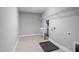 This laundry room has tile floors, utility sink, overhead rack, and washer dryer hookups at 126 Elmsford St, Durham, NC 27703