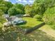 A fenced property with a lovely home, backyard, mature trees, and plenty of space at 12601 Boyce Mill Rd, Raleigh, NC 27613