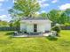 Charming backyard featuring a patio with outdoor furniture, a grill, and a lush green lawn at 12601 Boyce Mill Rd, Raleigh, NC 27613