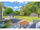 Outdoor patio and expansive backyard features grass, an outdoor seating area, and a barn at 12601 Boyce Mill Rd, Raleigh, NC 27613