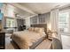 Cozy bedroom features a neutral color palette, comfortable bed, and bright natural light from the windows at 12601 Boyce Mill Rd, Raleigh, NC 27613