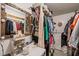 Walk-in closet features shelving, a mirror, and storage for clothes and accessories at 12601 Boyce Mill Rd, Raleigh, NC 27613