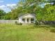 Charming home with a inviting front porch, lush green lawn, and mature trees at 12601 Boyce Mill Rd, Raleigh, NC 27613