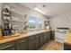 Updated kitchen featuring butcher block counters, stainless appliances and ample storage at 12601 Boyce Mill Rd, Raleigh, NC 27613