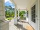 Inviting front porch offers a relaxing space with swing and view of the landscaped yard at 12601 Boyce Mill Rd, Raleigh, NC 27613
