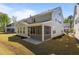 Spacious backyard featuring a two-story home with a screened porch and well-maintained lawn at 1265 Meadow Queen Ln, Apex, NC 27502