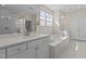 White Primary bathroom features a soaking tub, double vanity, and glass shower at 1265 Meadow Queen Ln, Apex, NC 27502