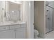 Bathroom featuring new fixtures and a beautifully tiled standing shower at 1265 Meadow Queen Ln, Apex, NC 27502