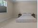 Neutral bedroom with a large window and comfortable bedding at 1265 Meadow Queen Ln, Apex, NC 27502