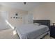 Comfortable bedroom features neutral paint, a ceiling fan, and a cozy gray bed at 1265 Meadow Queen Ln, Apex, NC 27502