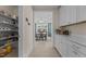 Hallway leading to dining room with natural light and convenient access to pantry at 1265 Meadow Queen Ln, Apex, NC 27502