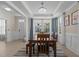 Dining room featuring modern chandelier, lots of light, and neutral wall color at 1265 Meadow Queen Ln, Apex, NC 27502