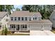 Charming two-story home with a welcoming porch and a spacious two-car garage, complete with manicured landscaping at 1265 Meadow Queen Ln, Apex, NC 27502