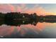Scenic lake at sunset with colorful sky reflecting on the water, surrounded by trees at 1265 Meadow Queen Ln, Apex, NC 27502