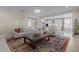 Open-concept living room featuring access to the kitchen with modern finishes at 1265 Meadow Queen Ln, Apex, NC 27502