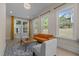 Inviting living area featuring hardwood floors, many windows, and vaulted ceilings at 1265 Meadow Queen Ln, Apex, NC 27502