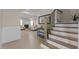 Open concept living room with hardwood floors, fireplace, and staircase at 1265 Meadow Queen Ln, Apex, NC 27502