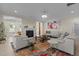 Bright living room featuring a fireplace, modern lighting, and stylish decor at 1265 Meadow Queen Ln, Apex, NC 27502
