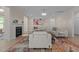 Cozy living room boasts a fireplace, modern furniture, and a colorful rug at 1265 Meadow Queen Ln, Apex, NC 27502