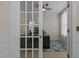 Home office features a desk and natural lighting from the large windows at 1265 Meadow Queen Ln, Apex, NC 27502