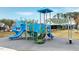 Community playground with slides, climbing bars, and play area in a landscaped neighborhood setting at 1265 Meadow Queen Ln, Apex, NC 27502