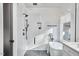 Modern bathroom featuring a sleek shower, white walls, and minimalist design for a spa-like experience at 1336 Courtland Dr, Raleigh, NC 27604