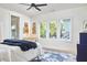 Cozy bedroom with large windows, modern decor, and comfortable furnishings create a restful ambiance at 1336 Courtland Dr, Raleigh, NC 27604