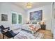 Bright bedroom with large windows, modern decor, and stylish furnishings for a comfortable retreat at 1336 Courtland Dr, Raleigh, NC 27604