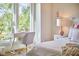 Bedroom with bright natural light, a writing desk and chair, and stylish decor at 1336 Courtland Dr, Raleigh, NC 27604