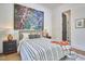 Bright bedroom featuring a stylish bed, artistic decor, and a tranquil ambiance for relaxation at 1336 Courtland Dr, Raleigh, NC 27604